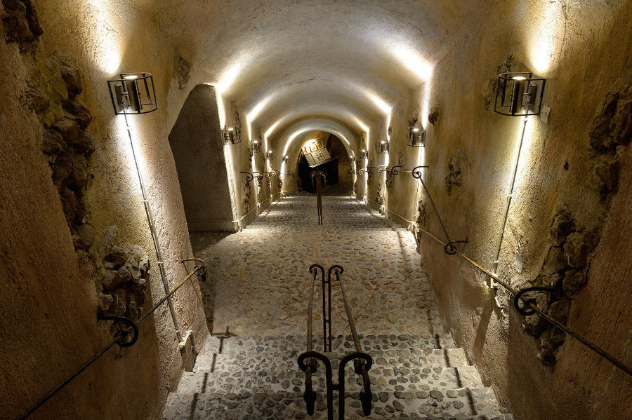 electric candlesticks on the stone walls of 'Koutsoyannopoulos Wine Museum'